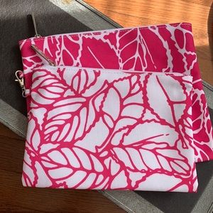 Pair of Clinique cosmetic bags in fuschia